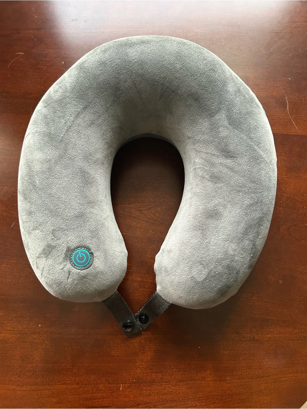 Gray vibrating travel neck pillow